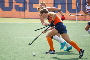 Emma Tufts (shown) looks for space Sunday afternoon at J.S. Coyne Stadium, where SU beat a ranked opponent and former Big East foe in Rutgers. 